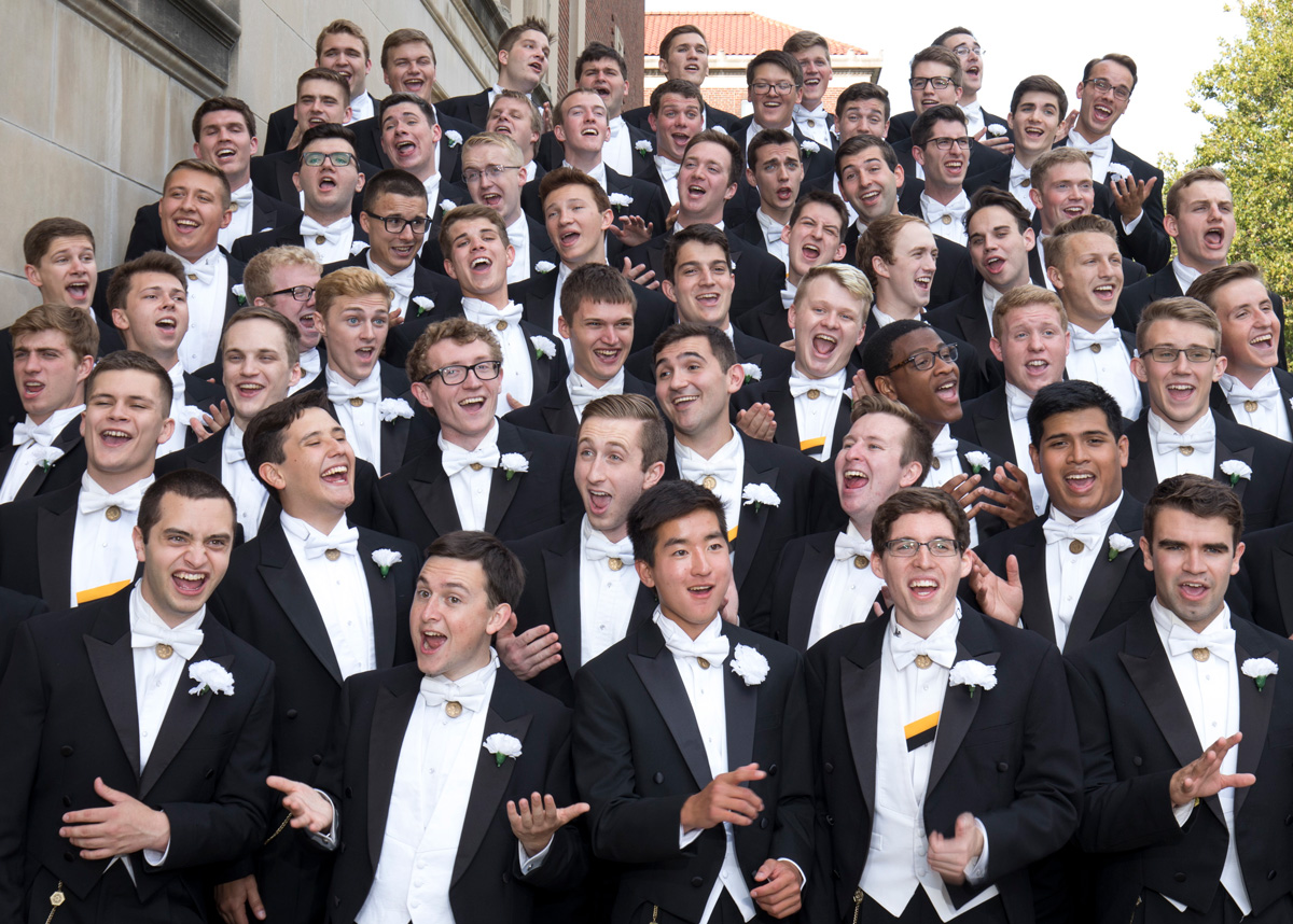 A group photo of Glee Club singing.