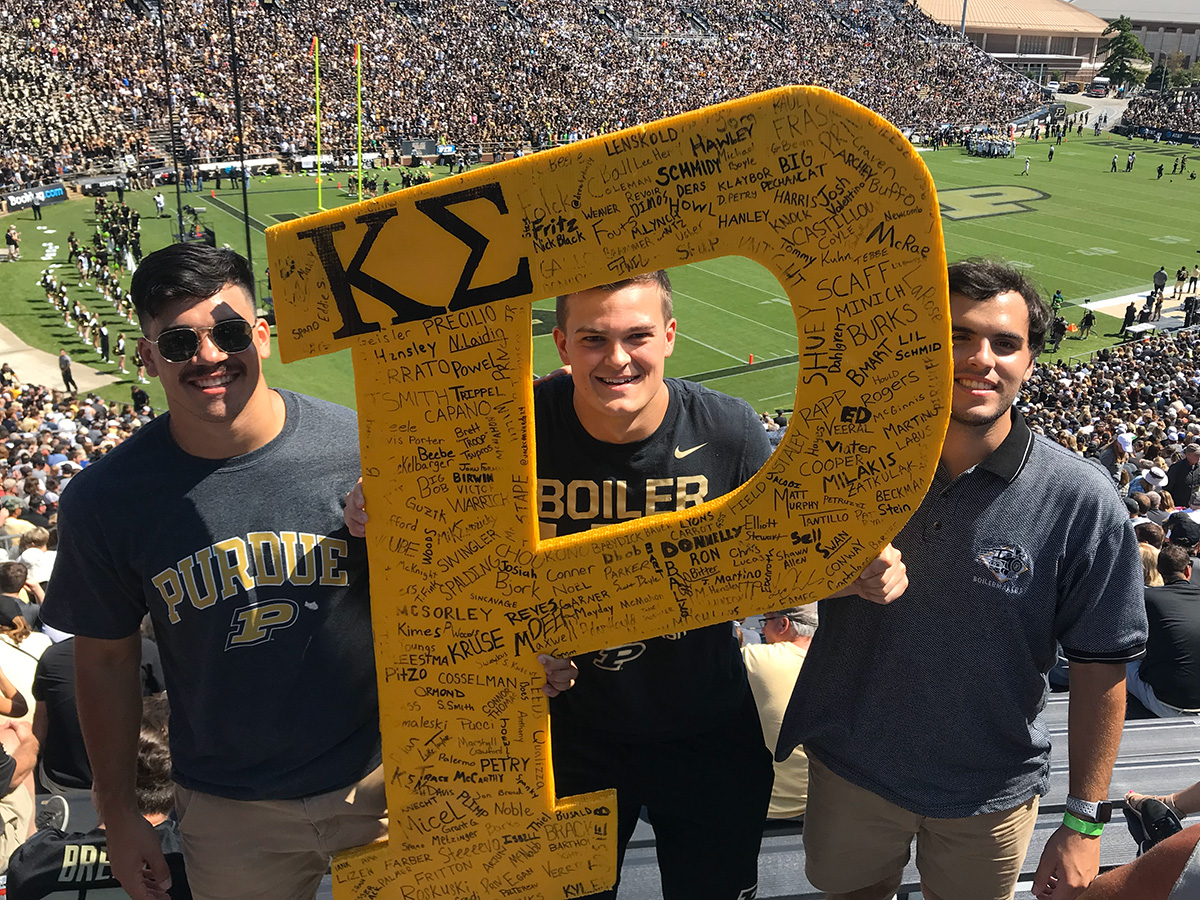 Kevin Boes with friends at a football game.