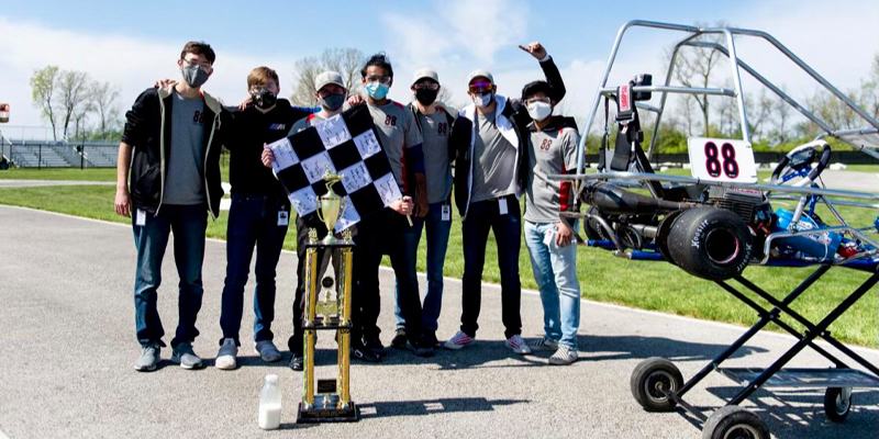 Members of Calvary Racing celebrate their victory.